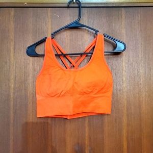 WOMEN'S ORANGE SIZE LARGE SPORTS BRA.